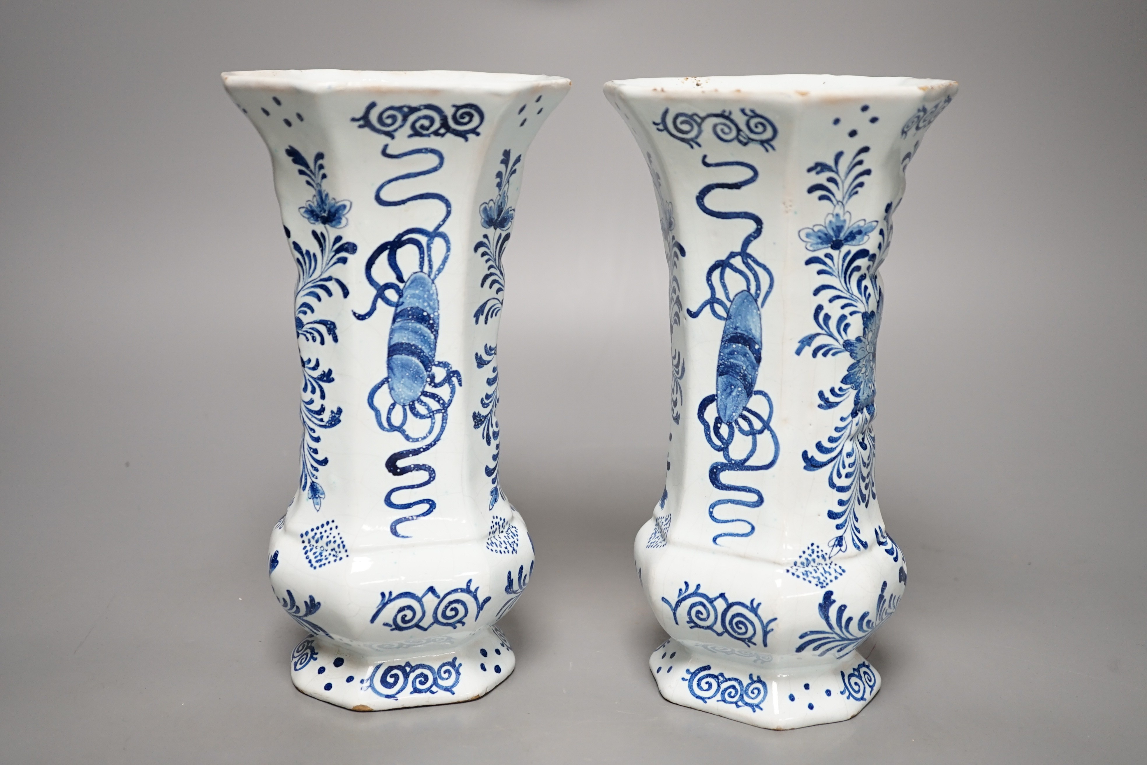 A pair of 19th century Delft blue and white vases 21.5cm